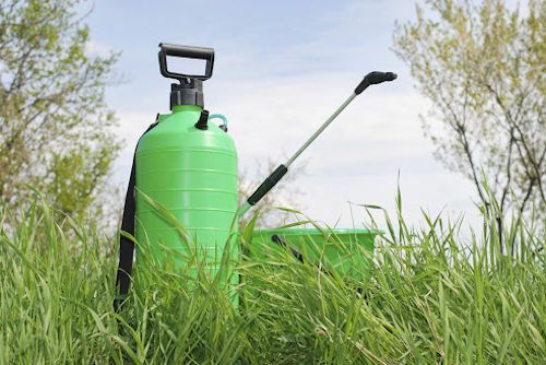 Pest spray placed on grassy area